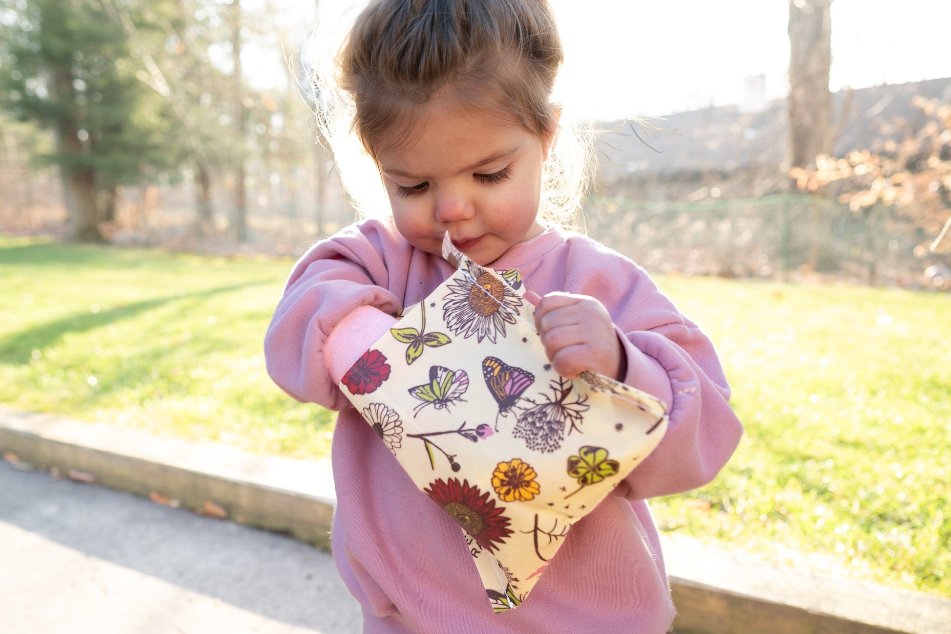 Child using a Bee's Wrap snack wrap